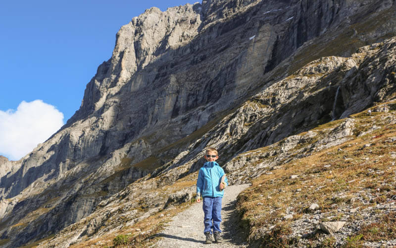 child hiking in Eiger trail in Grindelwald Switzerland