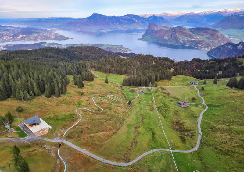 Pilatus alpine slide track and view of Lake Lucerne and mountains in central Switzerland