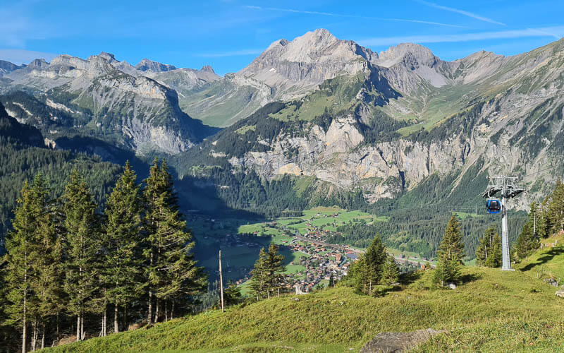 view of Kandersteg village, mountains and gondola car to Oechinensee